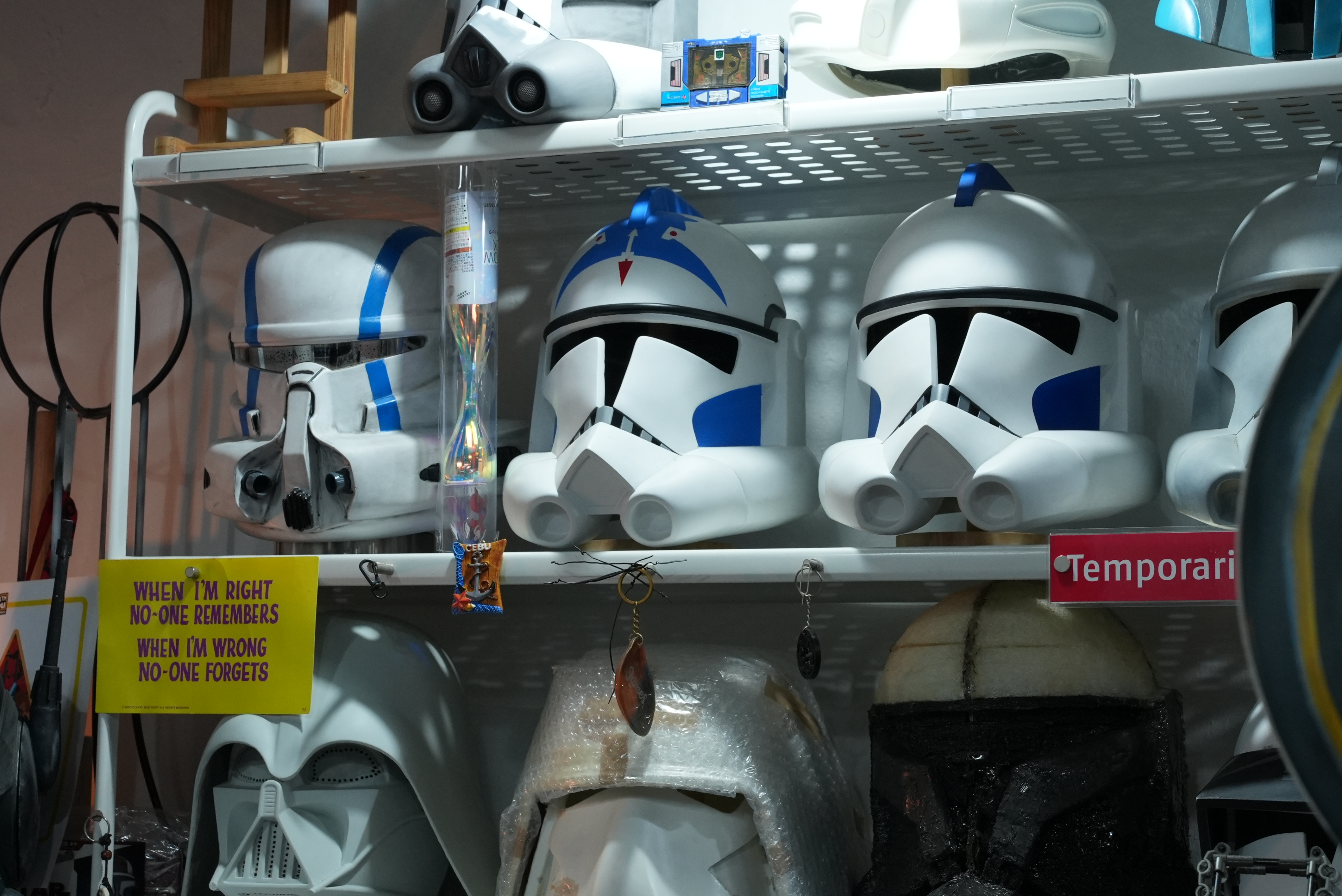 Star Wars clone trooper helmets at James Lim's desk.
