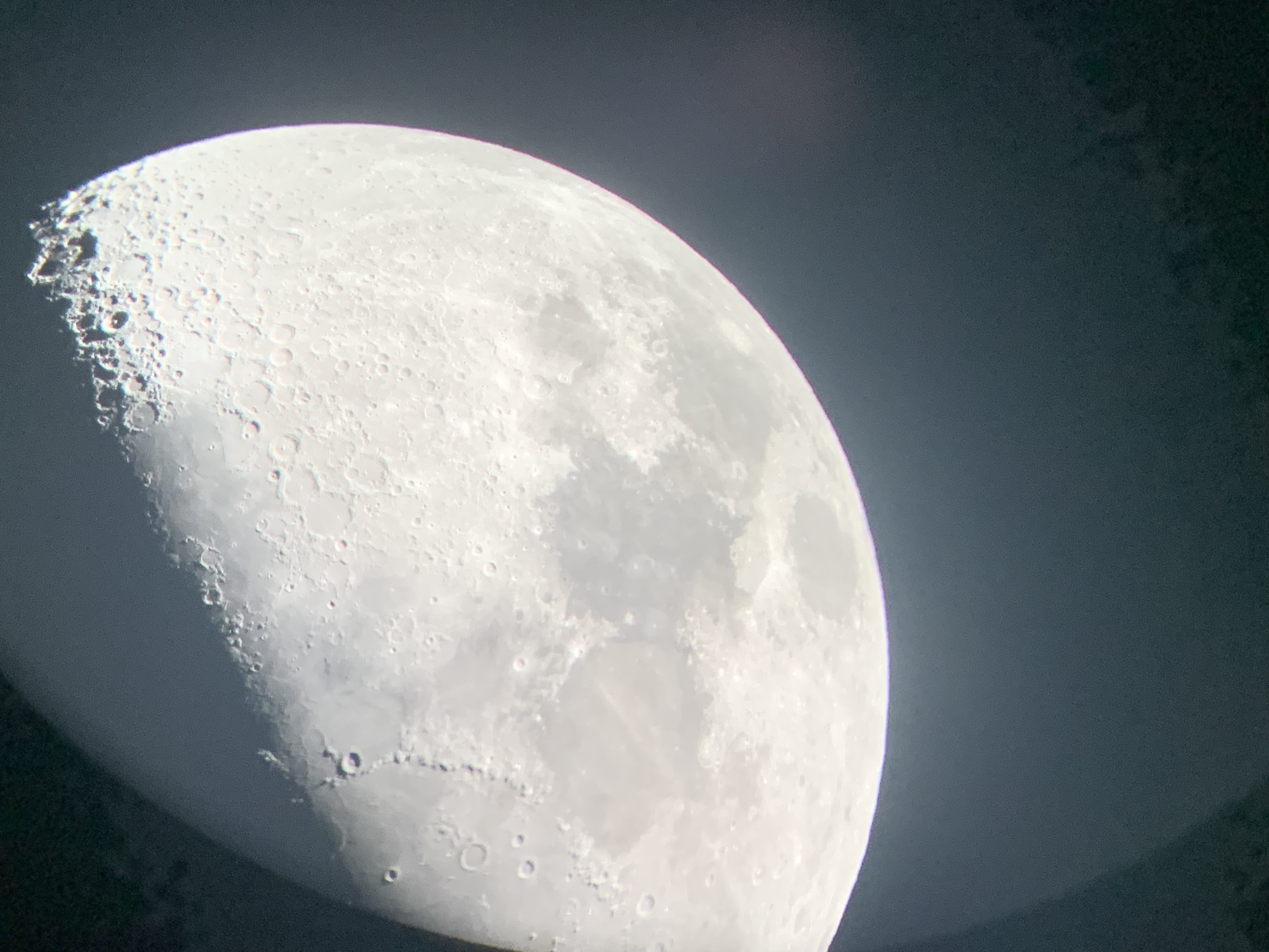 A photo of the moon taken with iPhone pressed to the telescope at Science Centre on 27/9/2024.