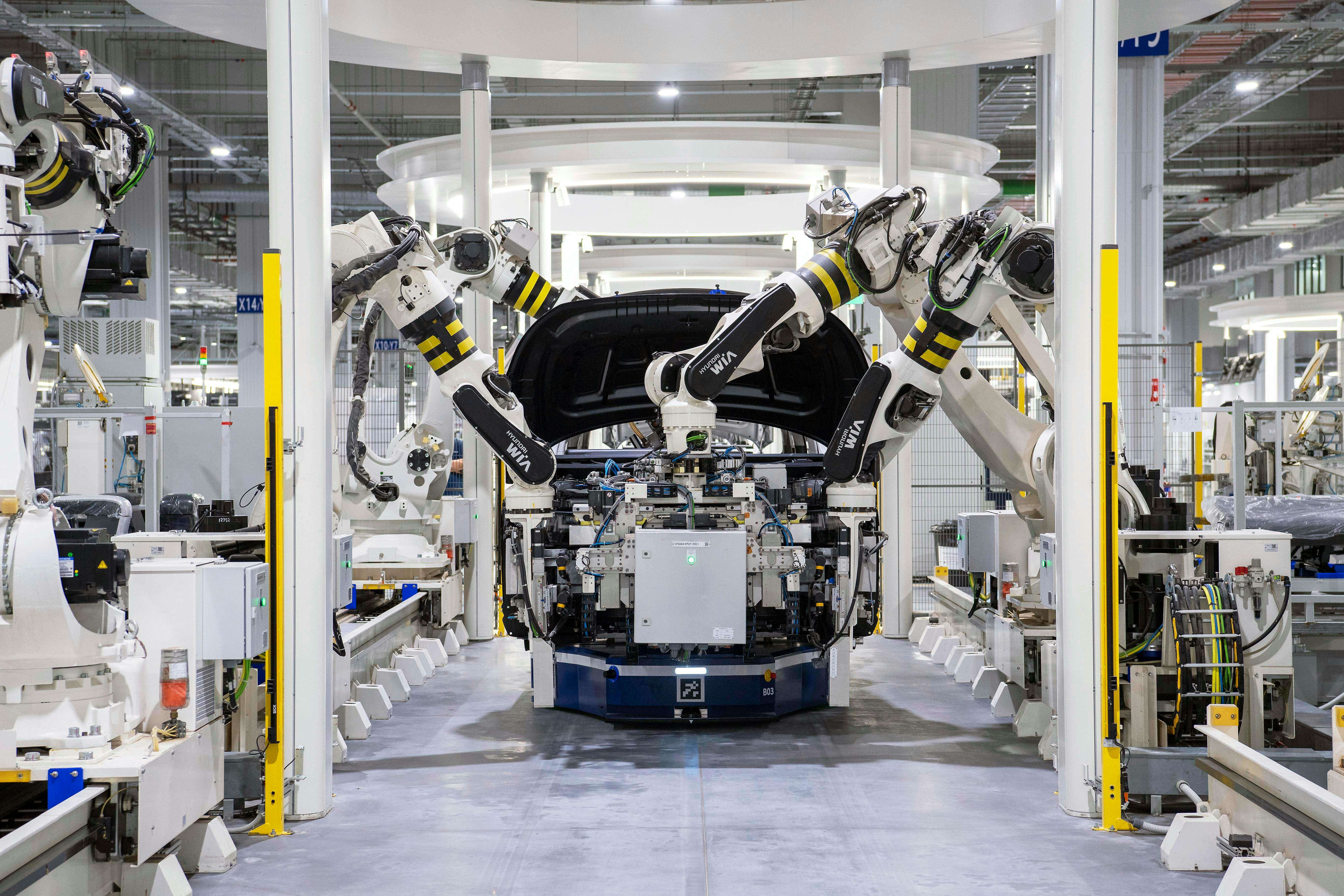Robotic arms on production line