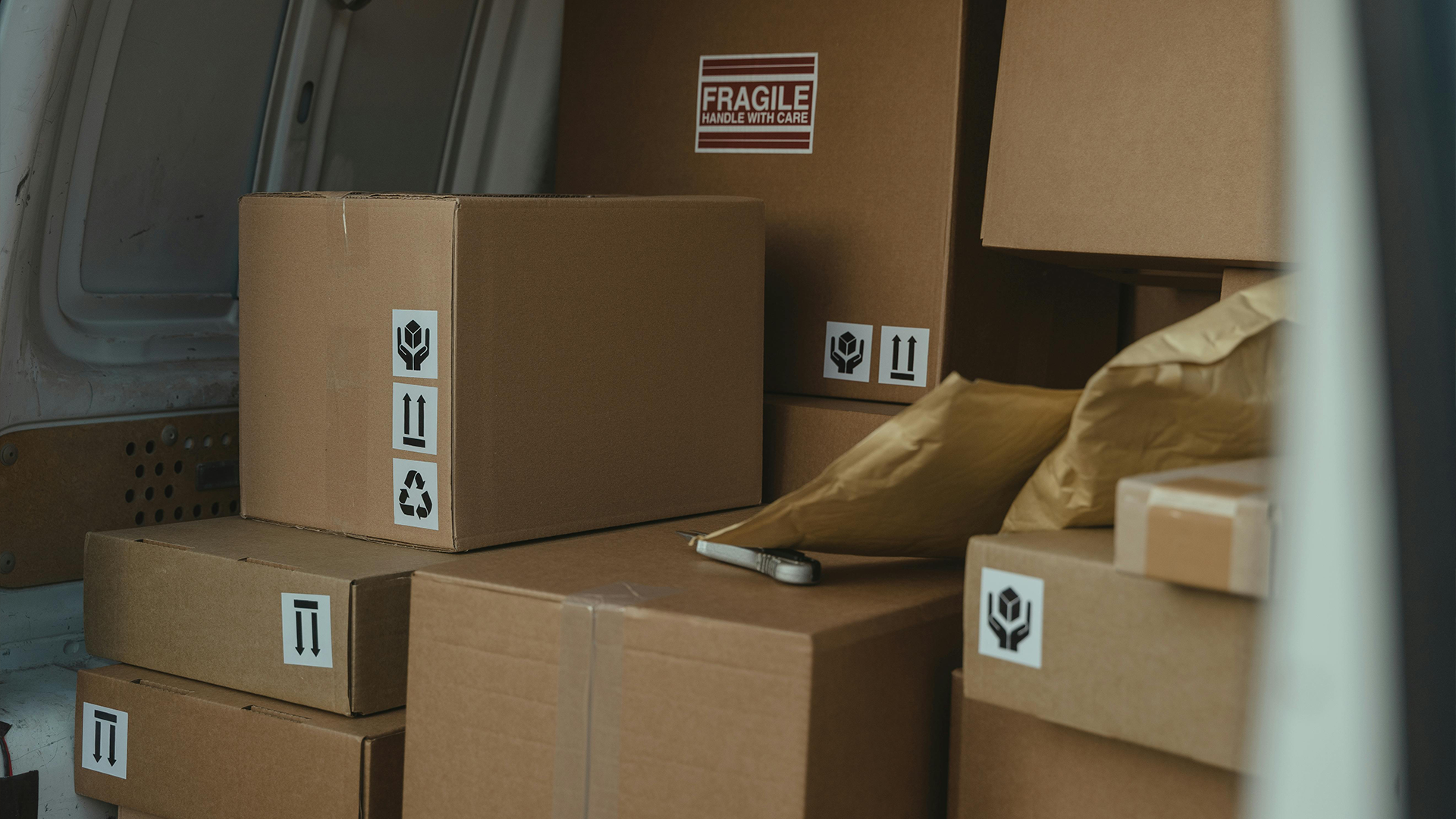 Cardboard parcels inside delivery van