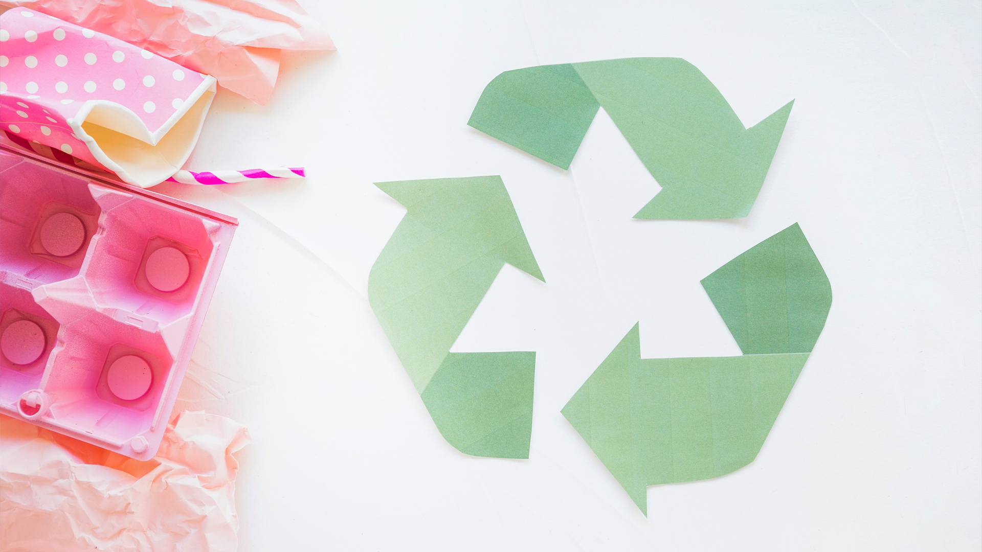 Recycle logo with colourful household trash (straws, paper cups, egg carton)